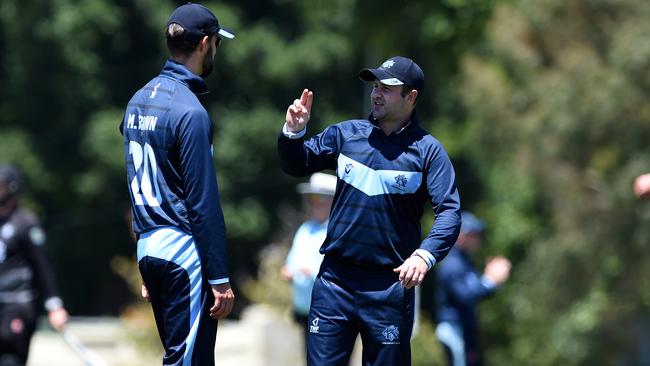 Kew skipper Chris Weeks talks to Matt Brown. Picture: Steve Tanner