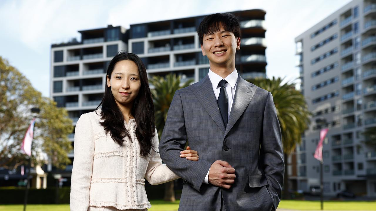 Inki Yun (right) and his partner Soyeon Jeon pictured at Remembrance Park around the corner from where their new unit is being built. Picture: Jonathan Ng