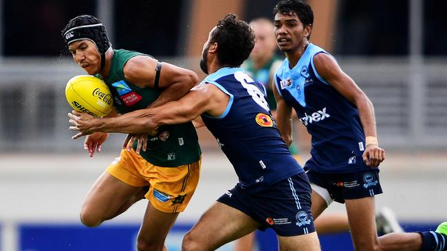 Ben Rioli under pressure from Buffalo Jarrod Stokes. The running defender is headed to WAFL club South Fremantle where the Rioli name is part of club folklore.