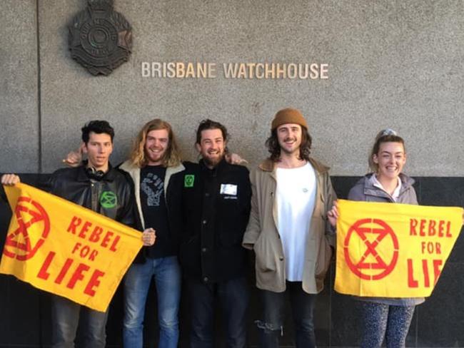 Extinction Rebellion South East Queensland protesters outside the city watchhouse last month including Tom Howell (centre).