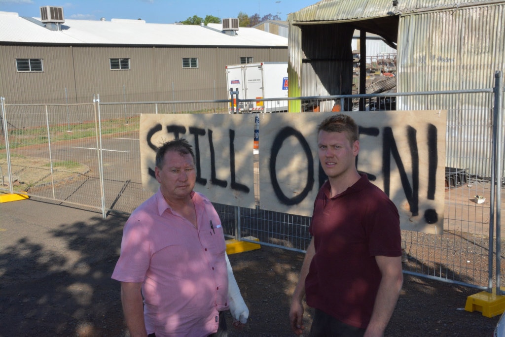 Sun Pine Furniture owner John Gietzel (left) and his son Brenton Gietzel are determined to rebuild a shed that was destroyed by fire. Photo Stuart Cumming / The Chronicle. Picture: Stuart Cumming