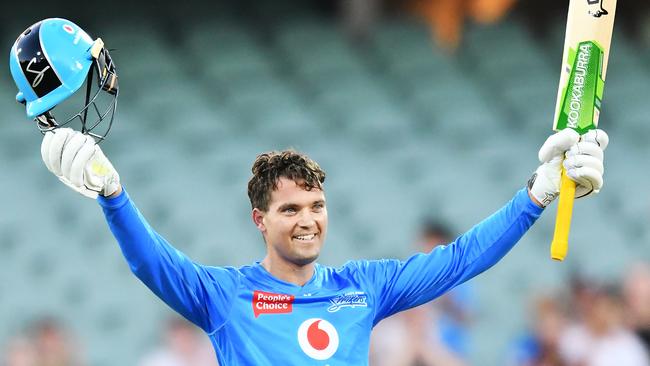 Alex Carey raises his bat after bringing up his century. Picture: Getty Images