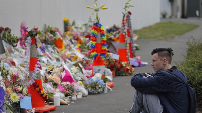 A student pays his respects at a park outside the Al Noor mosque in Christchurch. Picture: AP