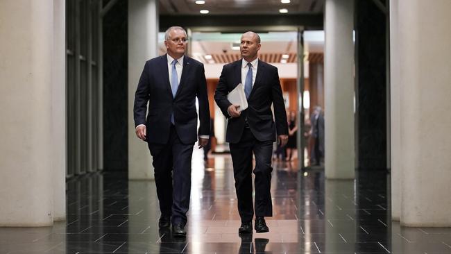 Scott Morrison, left, and Josh Frydenberg walk into the House of Representatives on the way to deliver the budget at Parliament House in Canberra on Tuesday night. Picture: Adam Taylor