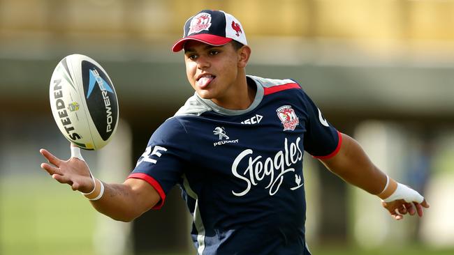 Latrell Mitchell reaches for the ball during Sydney Roosters training session.