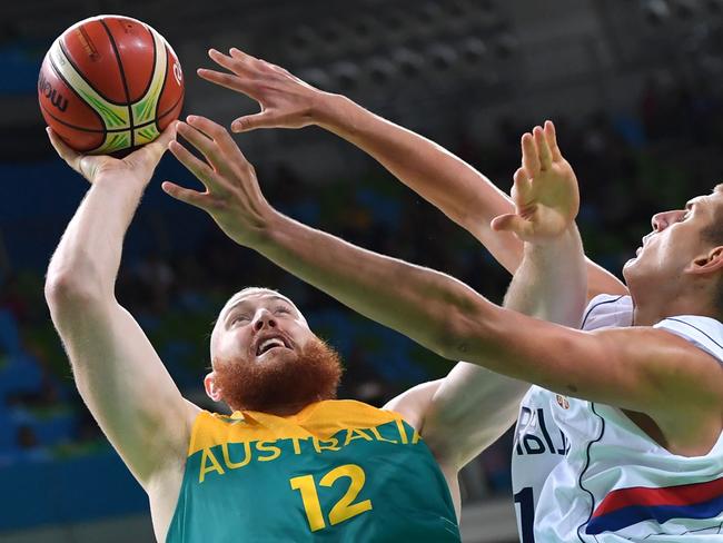 Serbia's Nikola Jokic (R) defends against Australia's Aron Baynes.