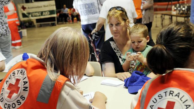 A mother registers her family with the Red Cross as part of a fire evacuation drill in the Noojee community in Victoria’s east.