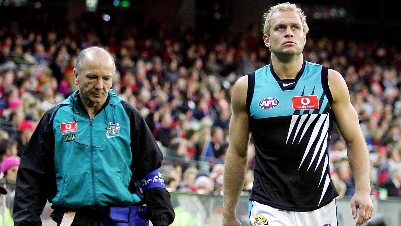Chad Cornes with Port Adelaide’s club doctor after they realised what had gone wrong.