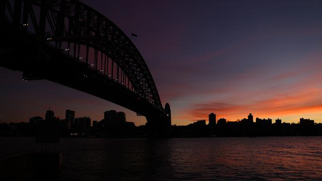 The sun rises over Sydney Harbour on a chilly Monday morning. Picture: NCA NewsWire / Dylan Coker