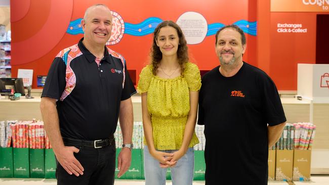 Target Group chief people and capability officer Tristram Gray, Indigenous Design Lab student Samara Francis and Indigenous Design Lab founder Leigh Harris unveil Target's new Deadly Store Network uniforms in Cairns on Tuesday. Photo: Supplied.