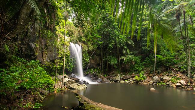 A dispute between a hinterland community and climbers who have been accused of altering rock faces and damaging vegetation on state land has turned nasty.