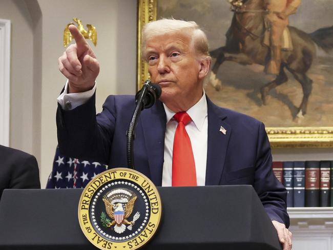 President Donald Trump speaks as C.C. Wei, chairman and CEO of Taiwan Semiconductor Manufacturing Company, right, and Commerce Secretary Howard Lutnick listen in the Roosevelt Room of the White House in Washington, Monday, March 3, 2025. (Pool via AP)