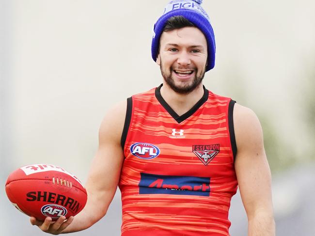 Conor McKenna of the Bombers stretches during an Essendon Bombers AFL training session at The Hangar in Melbourne, Tuesday, June 2, 2020. (AAP Image/Michael Dodge) NO ARCHIVING