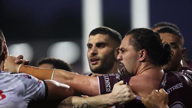 Josh Aloiai of the Sea Eagles scuffles with John Bateman of the Wests Tigers. Photo by Mark Kolbe/Getty Images.