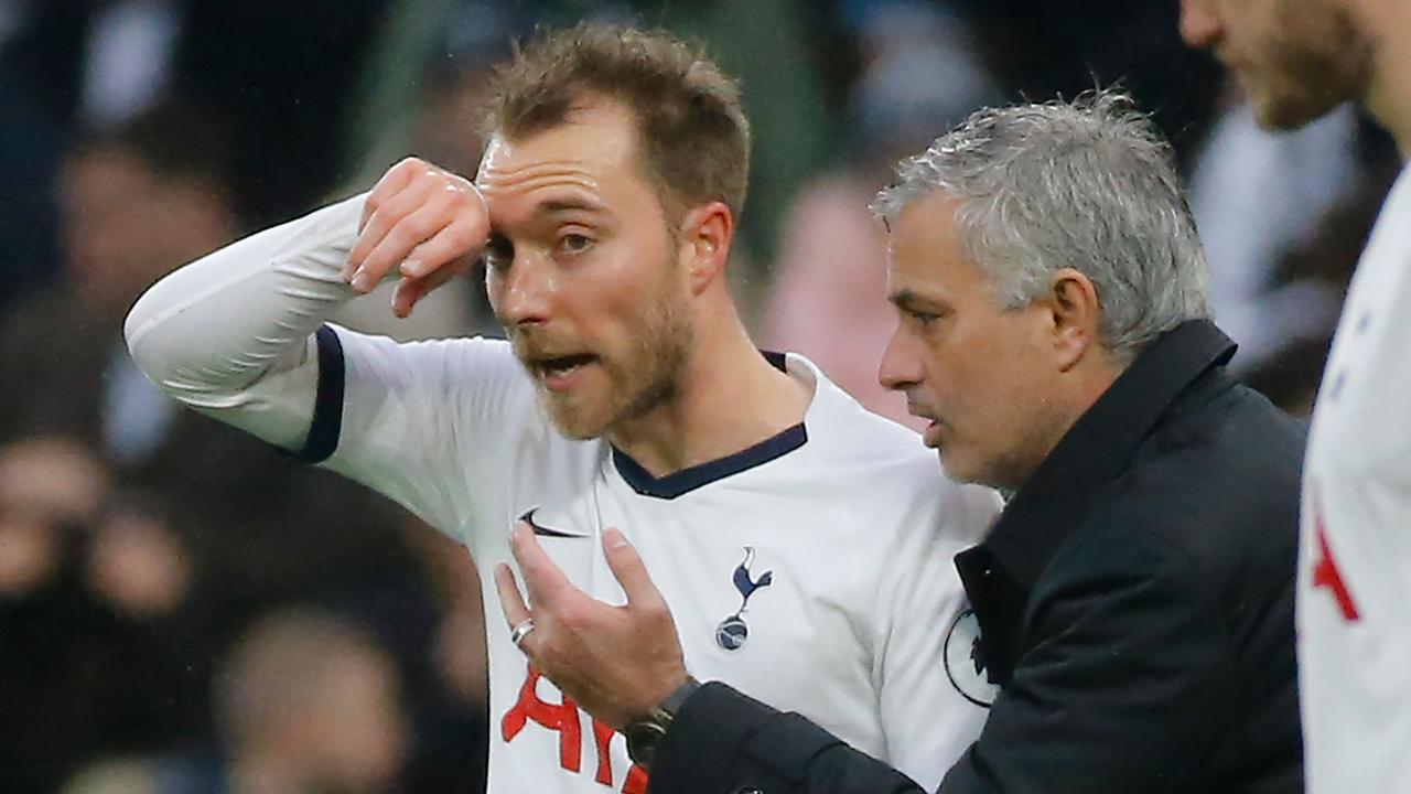 Tottenham Hotspur's Portuguese head coach Jose Mourinho (R) speaks to midfielder Christian Eriksen