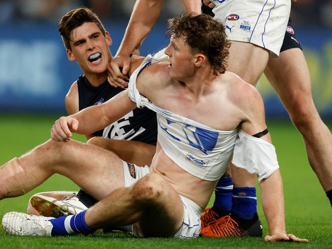 MELBOURNE, AUSTRALIA - APRIL 30: Nick Larkey of the Kangaroos and Lewis Young of the Blues clash during the 2022 AFL Round 07 match between the Carlton Blues and the North Melbourne Kangaroos at Marvel Stadium on April 30, 2022 in Melbourne, Australia. (Photo by Michael Willson/AFL Photos via Getty Images)