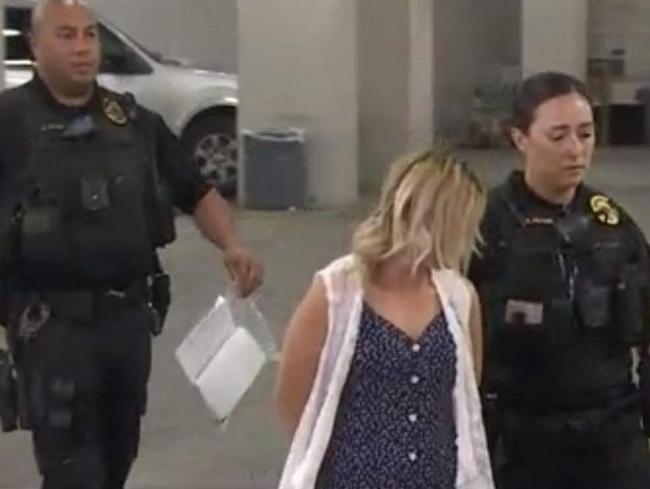 She was filmed being led to a court appearance in cuffs.