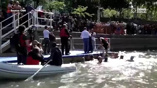 Paris mayor swims in River Seine ahead of Olympics