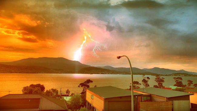 Reader Shane Mundy captured this terrific image of the lightning storm in Hobart from Tranmere last night. Picture: SHANE MUNDY