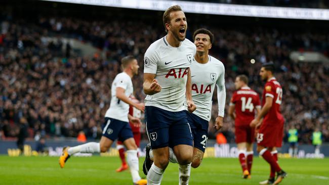 Tottenham Hotspur's English striker Harry Kane (C) celebrates after scoring.