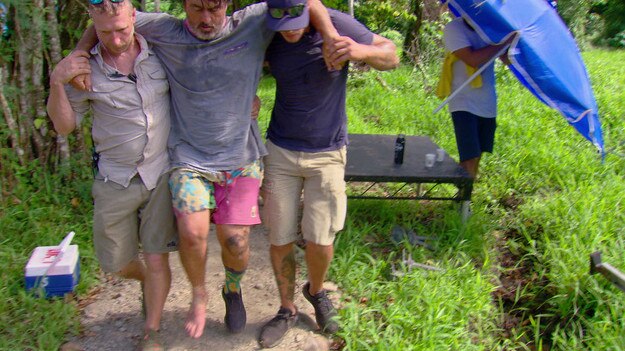 Ross Clarke-Jones is helped by medics on the set of Survivor Australia after injuring himself during a challenge. Picture: Network 10.