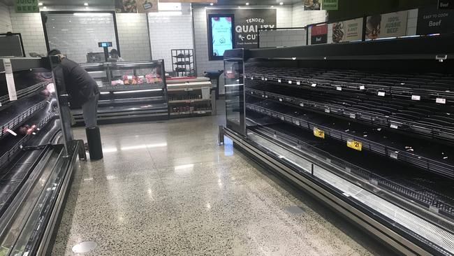 Meat section of Woolworths Ascot, Woolworths closed early on Wednesday night to restock shelves. Photographer: Liam Kidston