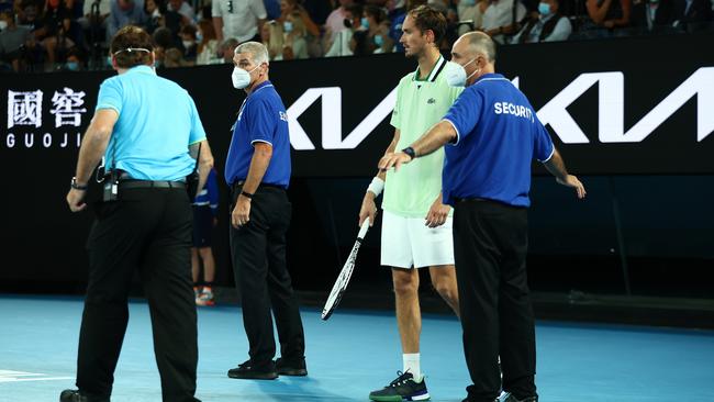 Security guards surround Daniil Medvedev during the court invasion. Picture: Getty Images