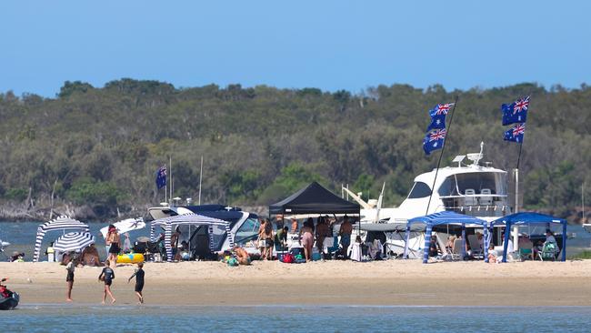 Plenty of boaties park up to enjoy some Australia Day fun at Wave Break Island. Picture: Adam Head