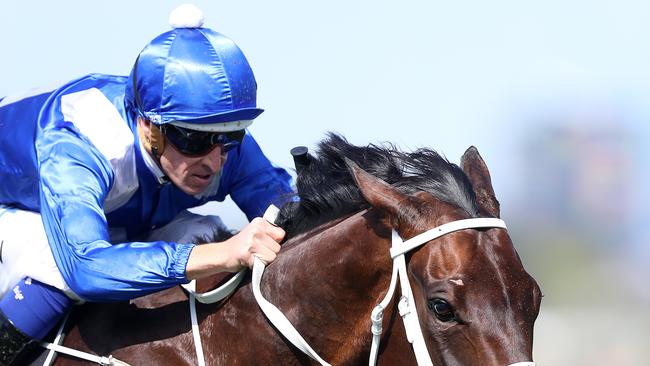 Winx and jockey Hugh Bowman go for home in the Turnbull stakes. Picture: Alex Coppel.