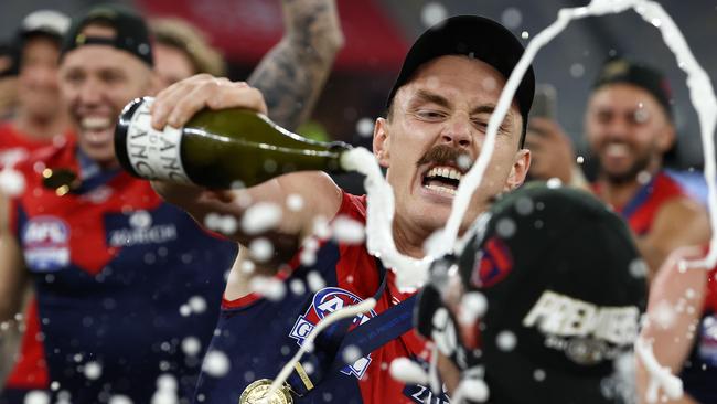 Jake Lever and his teammates get amongst it with some champagne moments. Picture: Michael Klein