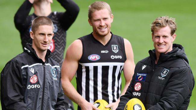 Clurey, middle, with teammates Hamish Hartlett and Tom Jonas on Friday. Picture: Mark Brake