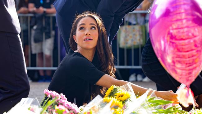 Meghan, Duchess of Sussex looks at floral tributes laid by members of the public on the Long Walk at Windsor Castle. (Photo by Chris Jackson - WPA Pool/Getty Images)