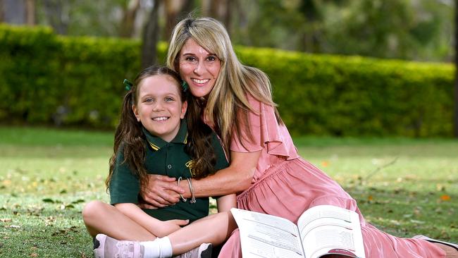 Emilie Springer with her mum Cassandra Springer is getting ready for a new year of school at Brookfield state school. Monday January 27, 2020. (AAP image, John Gass)