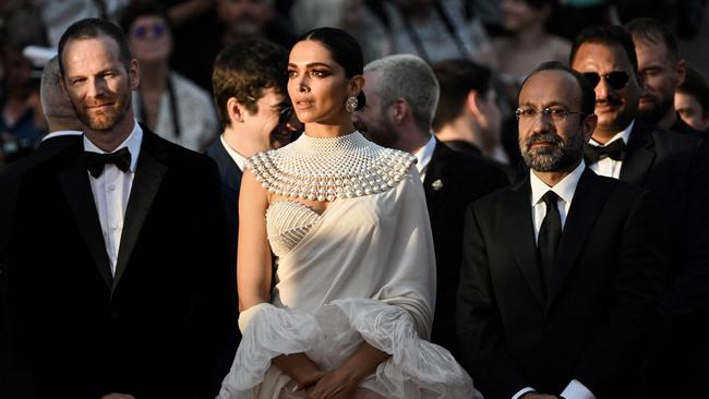 Members of the Jury of the Official Selection, Norwegian film director Joachim Trier, Indian actress Deepika Padukone and Iranian director Asghar Farhadi arrive for the Closing Ceremony of the 75th edition of the Cannes Film Festival in Cannes, southern France. Picture: AFP