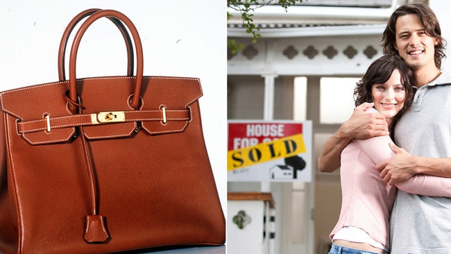 A Birkin handbag may be a betHandbag, happy couple in front of recently sold house. Picture: istock