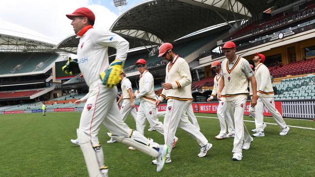 Redbacks players head onto voal afyter lunch break during day two of the Sheffield Shield match between South Australia and Tasmania at Adelaide Oval. Picture: Mark Brake/Getty Images