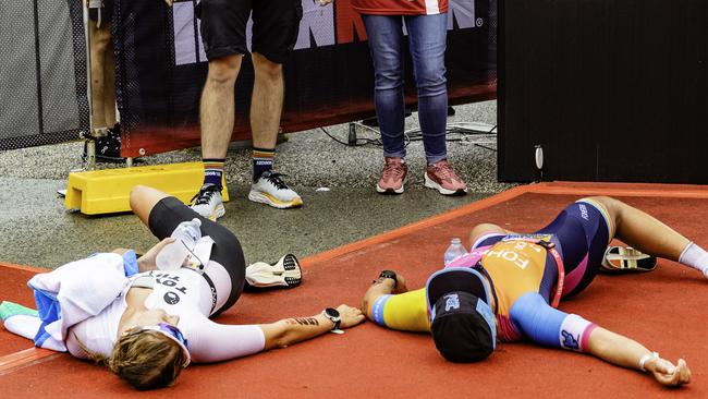 Triathletes Hanne De Vet and Penny Slater at the finish line of the Ironman 70.3 Tasmania in Hobart on Sunday 4th February 2024. Picture: Linda Higginson