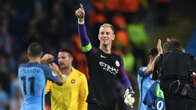 Manchester City's English goalkeeper Joe Hart (C) gestures to the crowd.