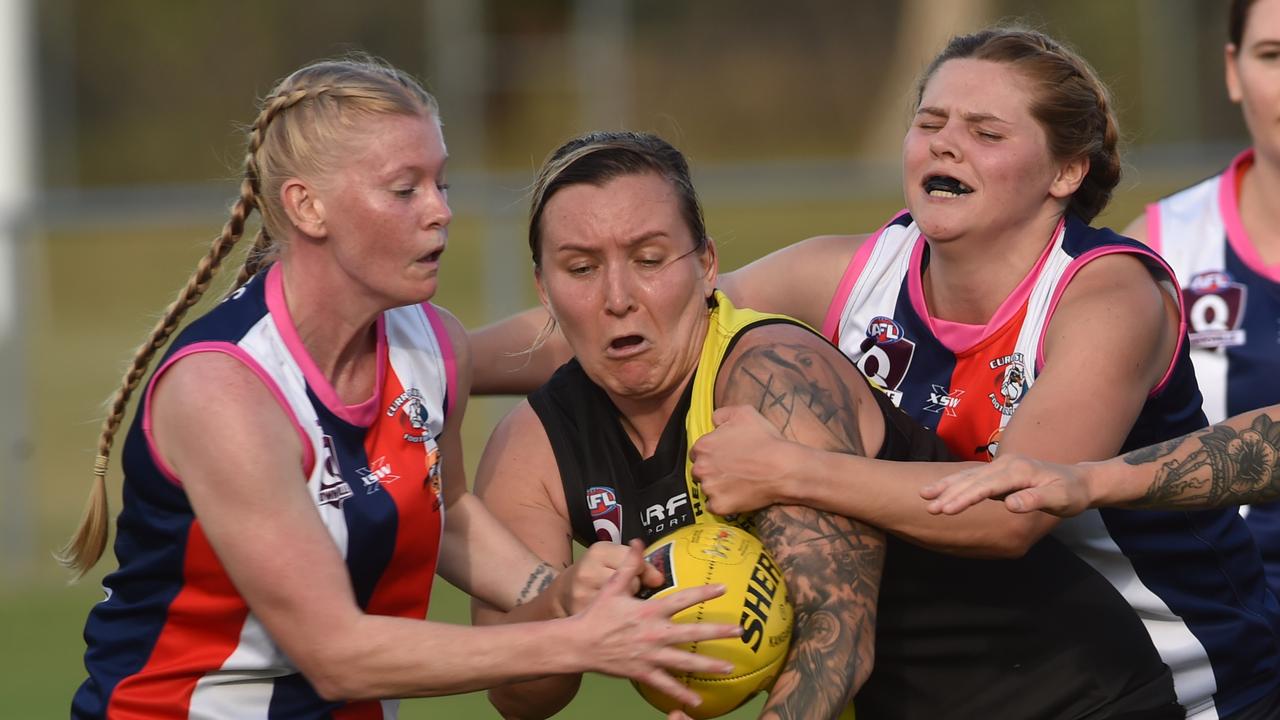 Townsville Women's AFL game between Hermit Park Tigers and Curra Swans at Murray Sporting Complex. Swans Montana Dove and Mikayla Abson and Tigers Hayley Cornish. Picture: Evan Morgan