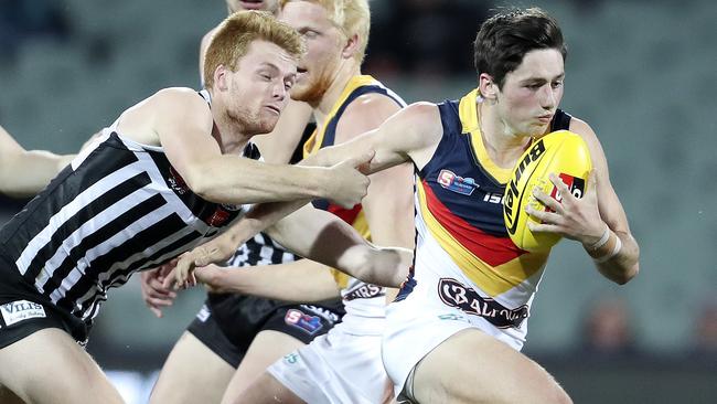 Chayce Jones breaks away from Port Adelaide’s Willem Drew in the SANFL finals. Picture: SARAH REED