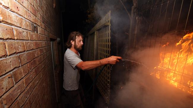 Tathra resident Julian Brown, 33, fought a spot fire at the back of his house in the early hours of the morning.