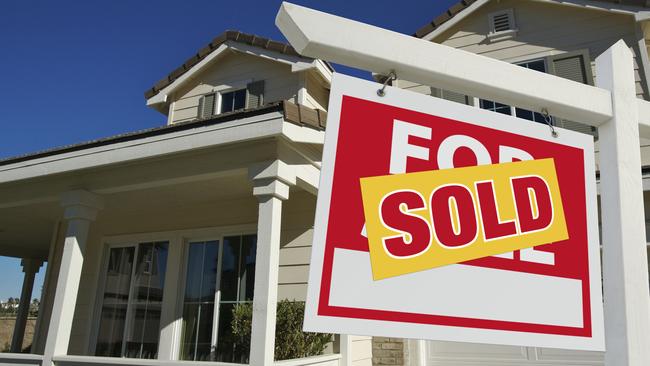 Sold Home For Sale Sign in Front of New House