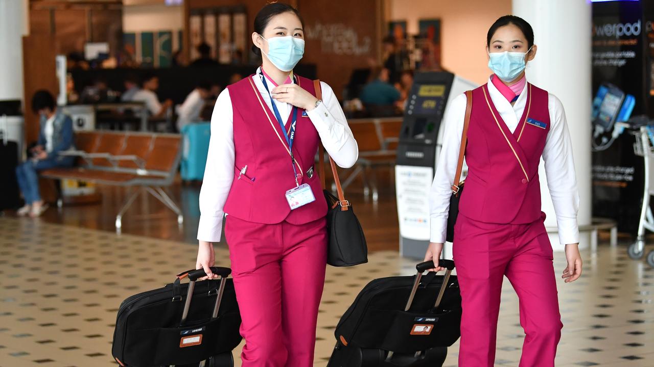 China Southern Airlines cabin crew wearing face masks at Brisbane International Airport this week. Picture: Darren England/AAP