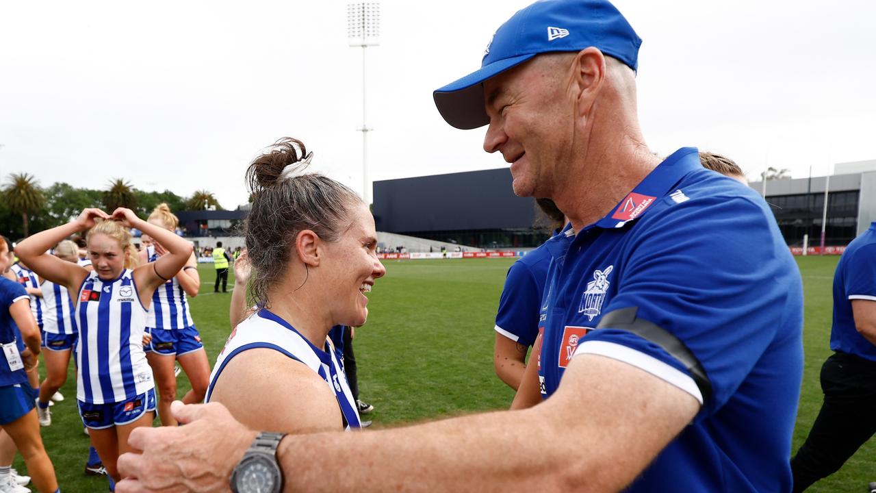 MELBOURNE, AUSTRALIA - NOVEMBER 26: Emma Kearney (left) and Darren Crocker, Senior Coach of the Kangaroos celebrate during the 2023 AFLW Second Preliminary Final match between The North Melbourne Tasmanian Kangaroos and The Adelaide Crows at IKON Park on November 26, 2023 in Melbourne, Australia. (Photo by Michael Willson/AFL Photos via Getty Images)
