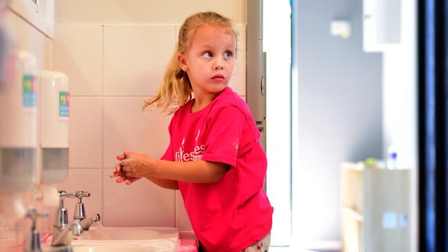 Sophie McCarthy washes her hands.