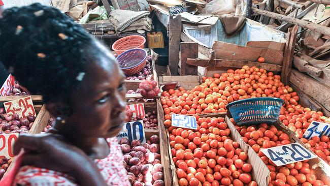 A vendor sells tomatoes in Nairobi on March 16. African countries are feeling the pain of Ukraine's crisis as supply disruptions hike inflation and oil prices push up fuel costs, doubling diesel prices for African countries like Nigeria.