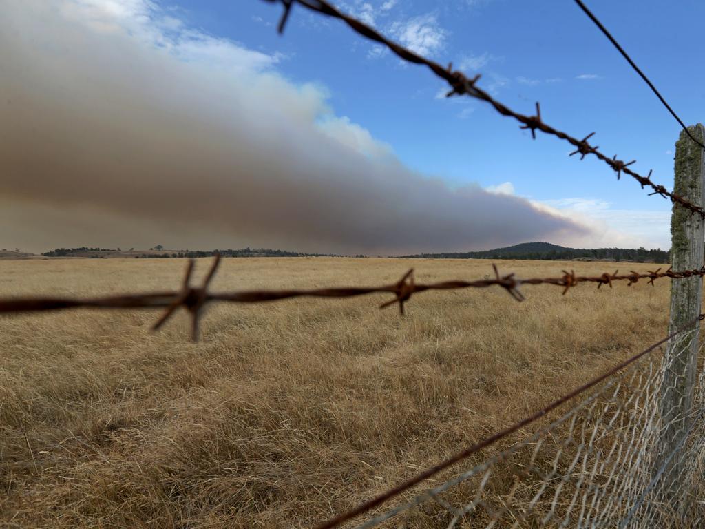 Smoke from Central Highlands fires blows across farmland near Bothwell. Picture: PATRICK GEE