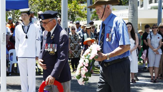 Stan Carswell MBE and Neville O'Brien each lay a wreath at the Cairns RSL's Remembrance Day service at the cenotaph on the Cairns Esplanade. Picture: Brendan Radke