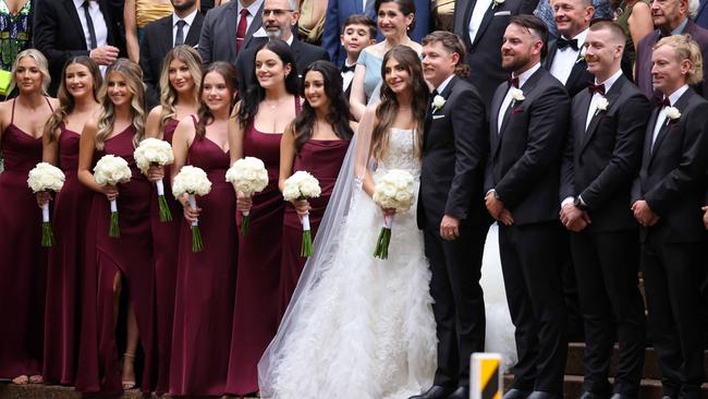 Naoum’s bridesmaids looked beautiful in burgundy, and the blokes scrubbed up nicely in their tuxes.