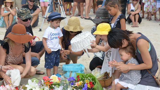 People gathered at Shelly Beach, Ballina to pay their respects for Japanese surfer Tadashi Nakahara. Picture: Brian Pamphilon